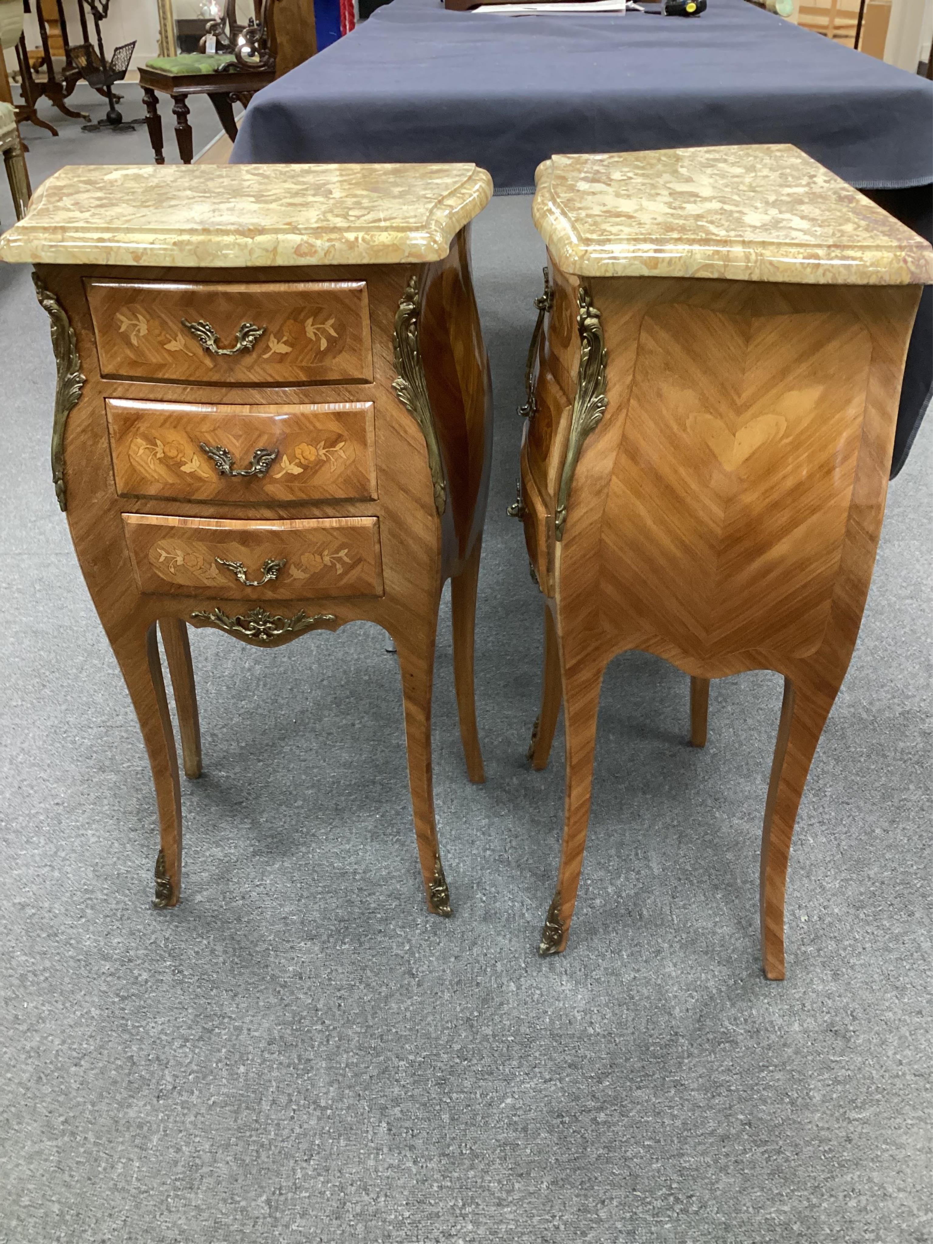 A pair Louis XVI style inlaid kingwood, gilt metal mounted bombe marble top of bedside chests, width 42cm, depth 27cm, height 74cm. Condition- good.